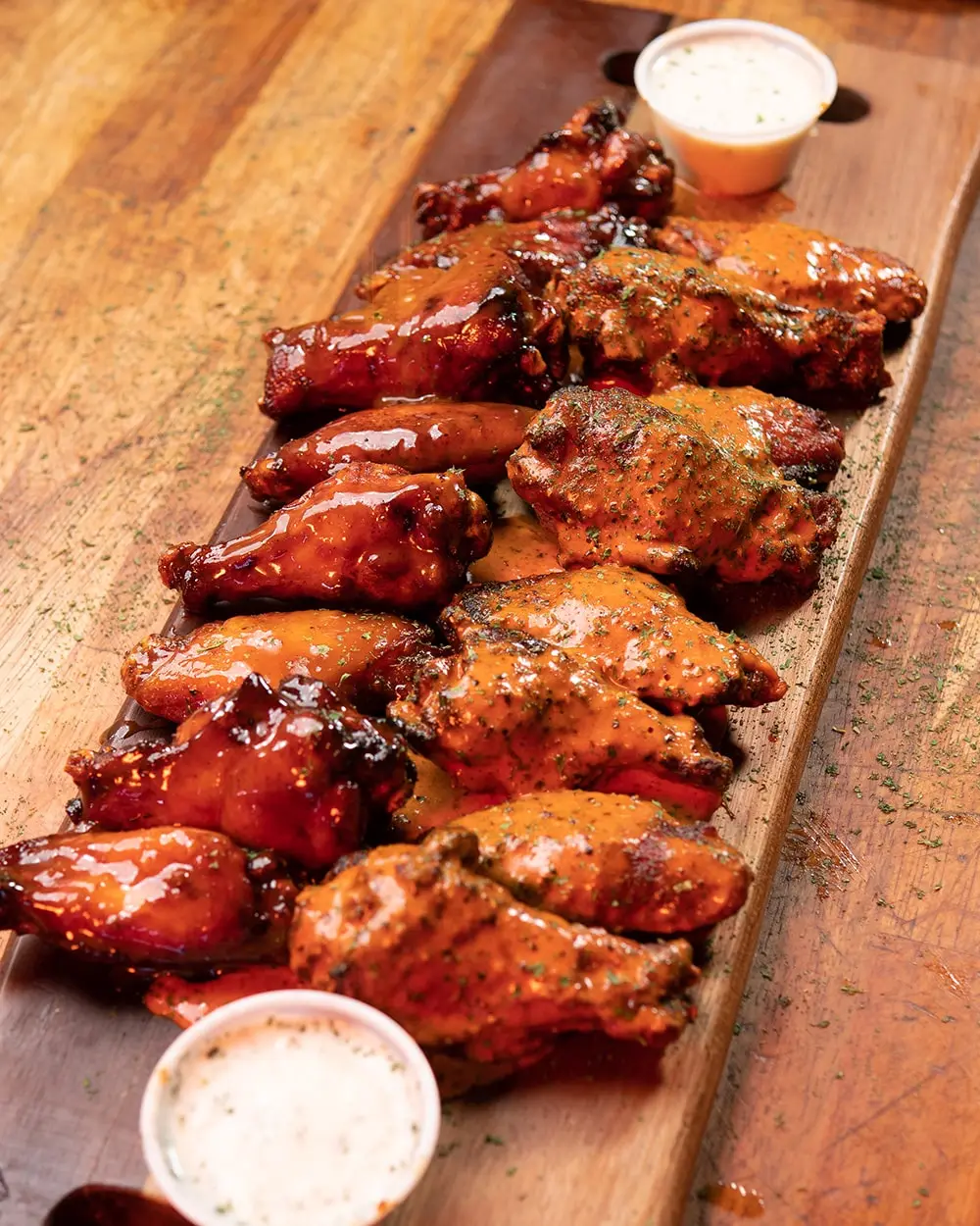 Buffalo wings from Abbey’s Real Texas BBQ in Mira Mesa, San Diego, tossed in spicy house-made buffalo sauce and served fresh from the smoker