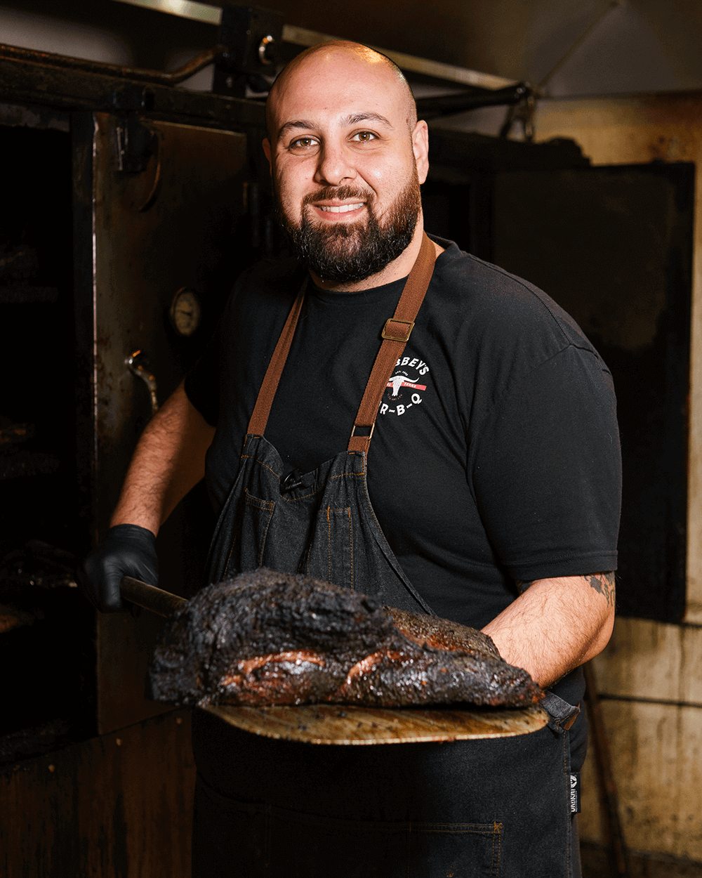 18–24-hour smoked brisket at Abbey’s Real Texas BBQ in Mira Mesa, San Diego, showing authentic Texas-style BBQ smoker and peppery bark