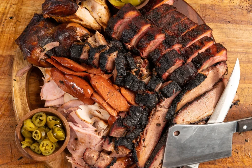 Slow-smoked brisket plate with BBQ sauce at Abbey’s Texas BBQ San Diego.