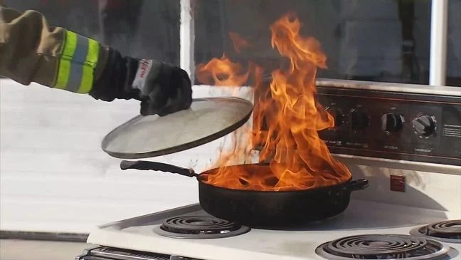 Turkey fryer fire caused by hot oil overflowing and igniting, showing a common Thanksgiving cooking hazard and dangers firefighters warn about every year.